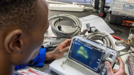 Man installing a proximity detection system 