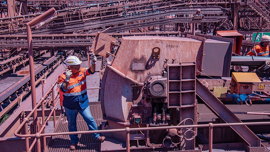 Image of Weba Chute Systems site manager inspecting a Weba super flow chute