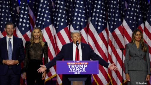 Republican Presidential nominee and former US President Donald Trump takes the stage with his wife Melania, his son Eric, and his daughter-in-law Lara, following early results from the 2024 US Presidential election in Palm Beach County Convention Center, in West Palm Beach, Florida.