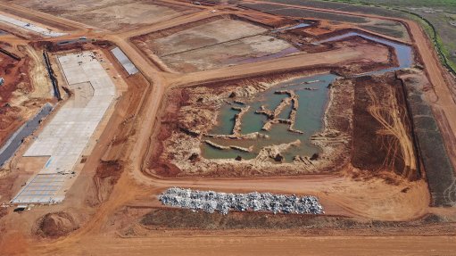 Two HDPE lined earth dams have been constructed close to the ADF, with Dam 1 for polluted water and Dam 2 for clean water. Each dam is compartmentalised into two basins. Image shows these under construction