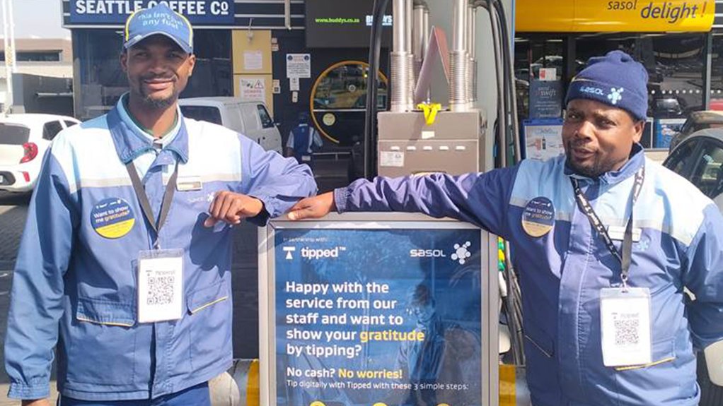 Image of two petrol attendants at a Sasol service station