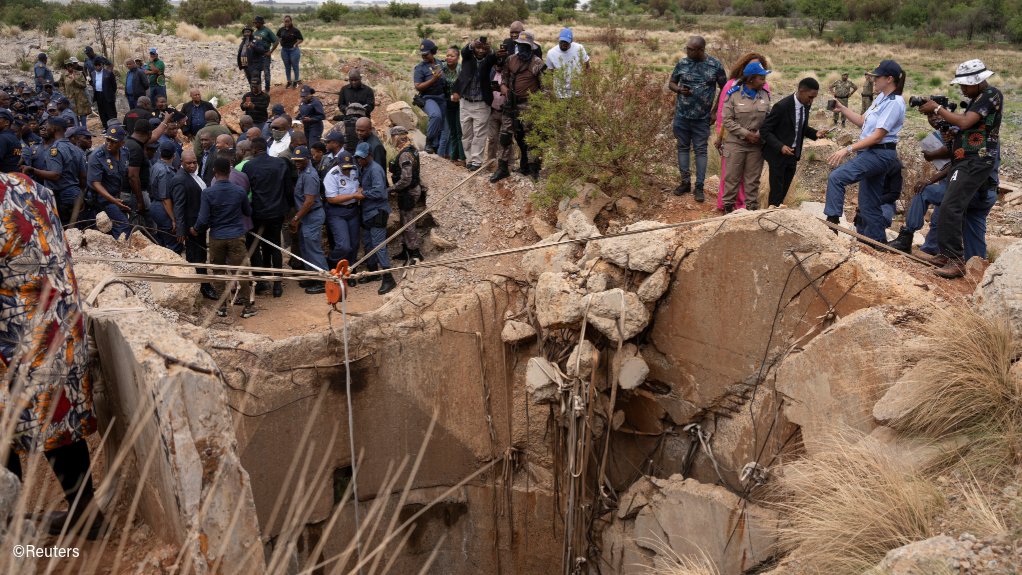 Police gathered at an illegal mining operation in Stillfontein