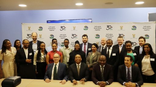 A group photo taken at the signing ceremony attended by Electricity and Energy Minister Dr Kgosientsho Ramokgopa, seated at centre