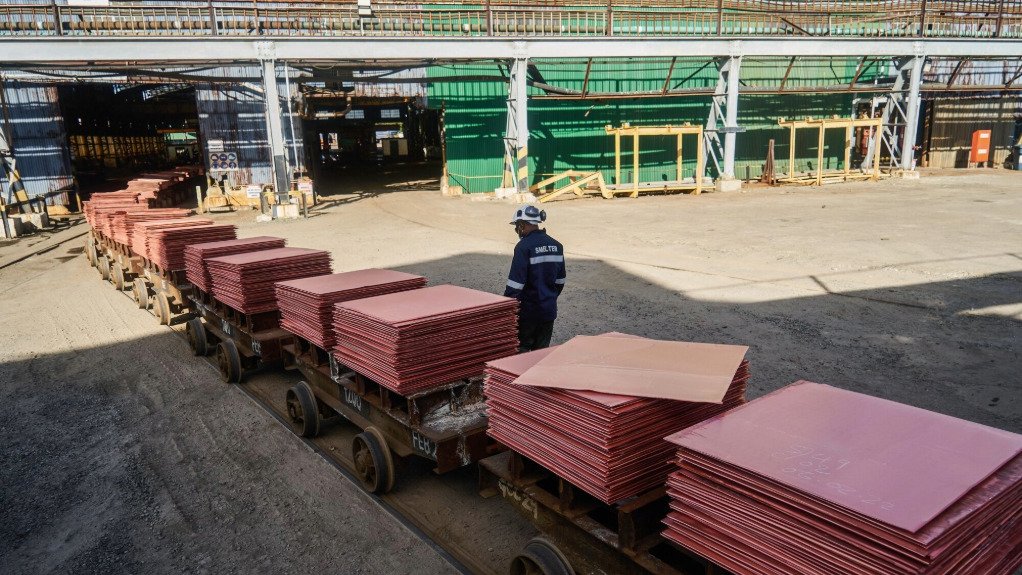 The above image depicts a worker transporting materials