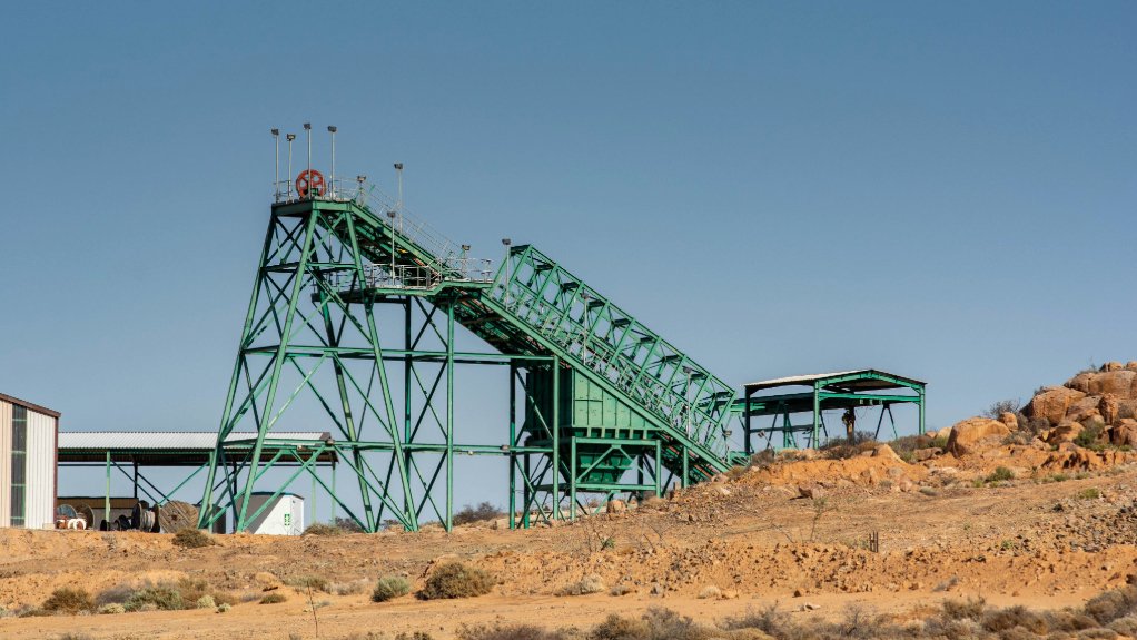 A large green headgear at the Steenkampskraal Mine near Vanrhynsdorp in the Western Cape