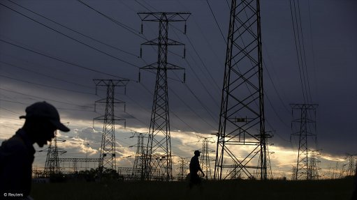 People walking near transmission lines