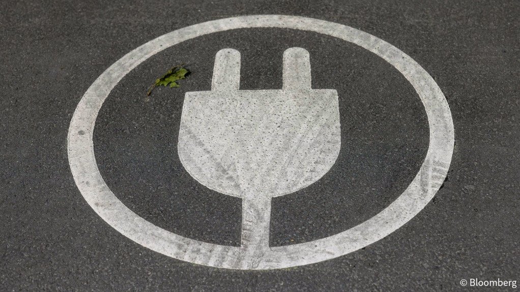 An EV charging sign painted in a parking space