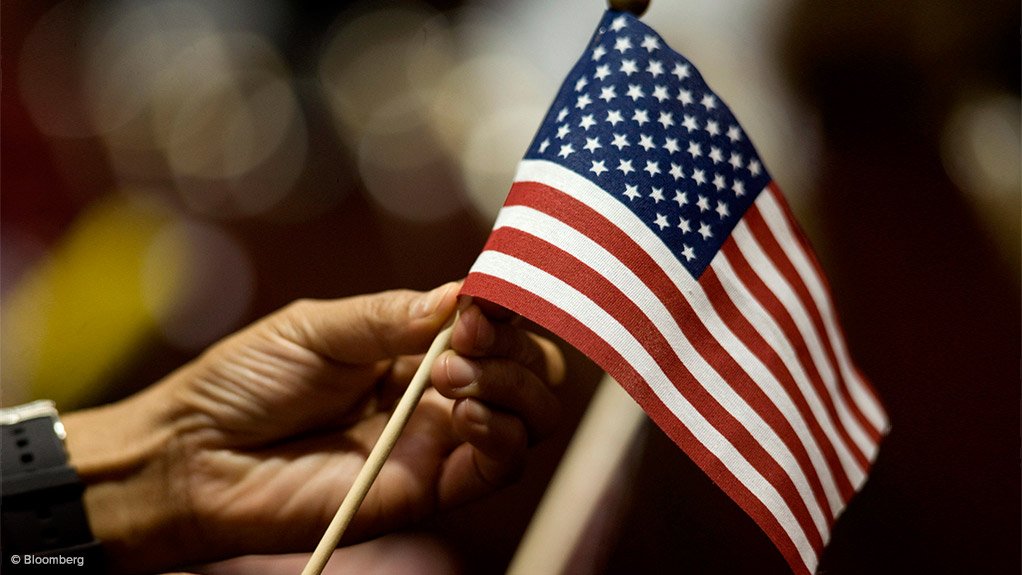 Hand holding a US flag