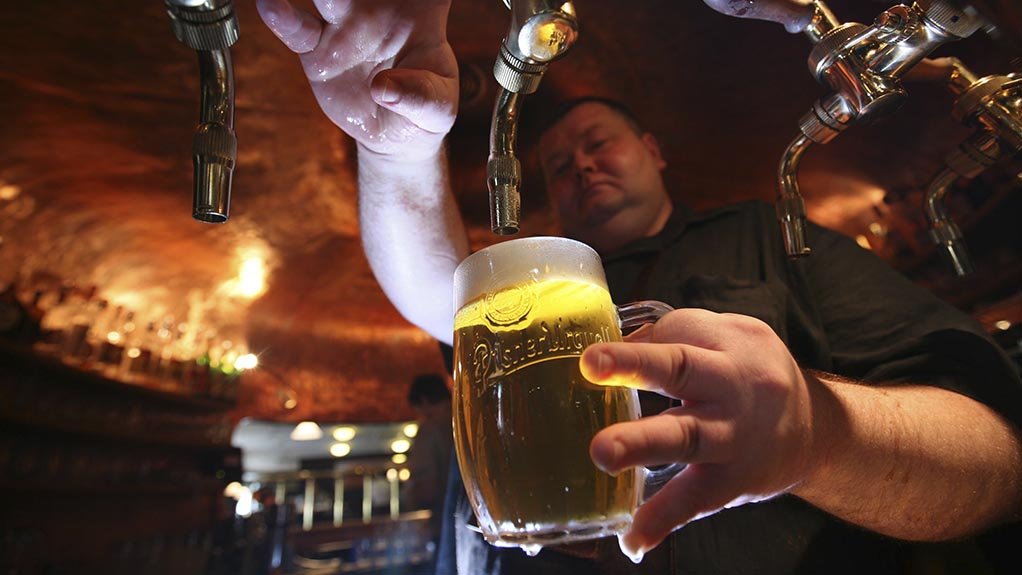 dude pouring beer from a tap