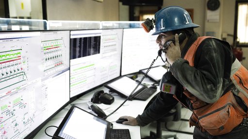 Image of a technician in front of a digital screen