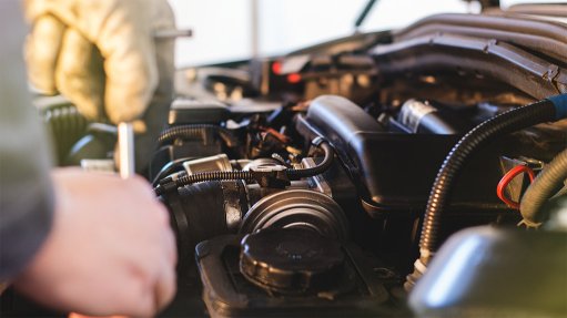 Mechanic working on a car engine