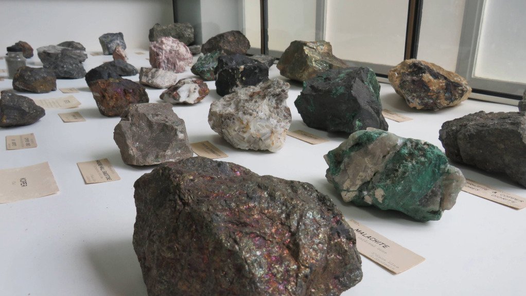 A table laid with a range of minerals and ores which can be found on the African continent