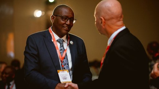 two important men in suits shaking hands at last year's  Investing in African Mining Indaba