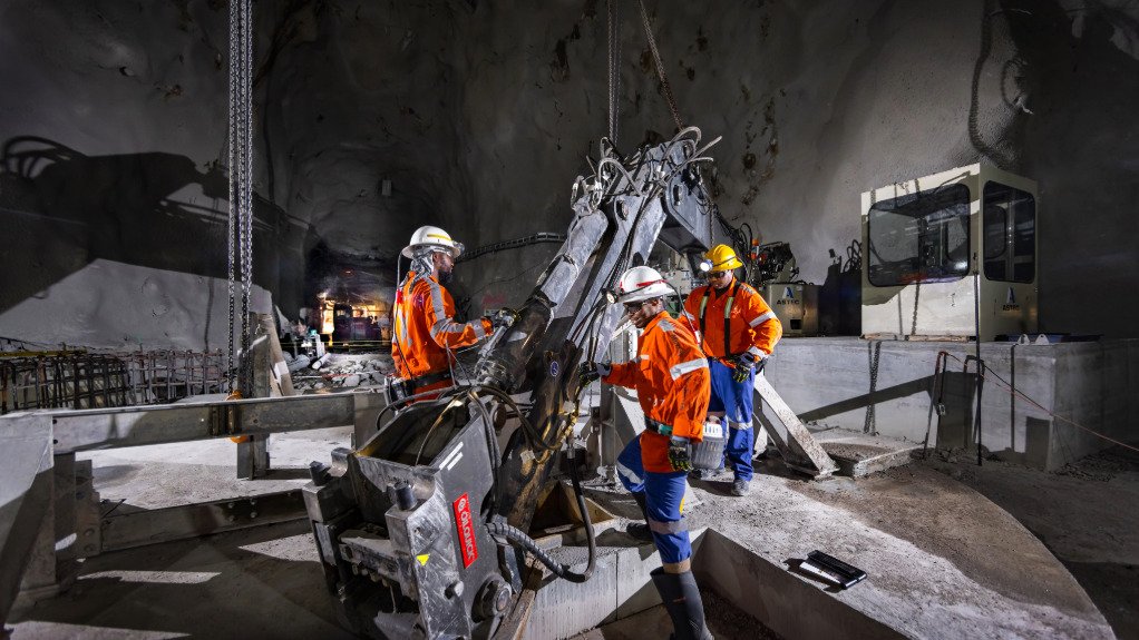 Three men underground using a Murray & Roberts system