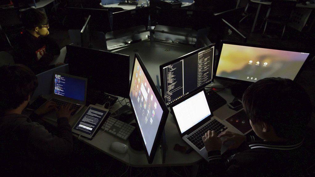 Man with computer screens