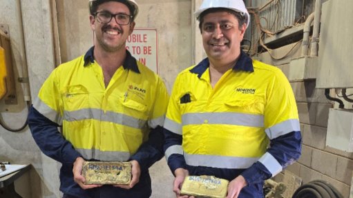 Senior project geologist Jacob Lynch-Harlow (Norton) and Horizon CFO Julian Tambyrajah with the first gold bars poured from the Boorara project.