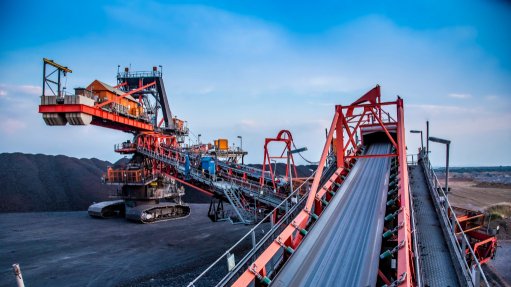 Image of conveyor belts channelling ore into a Weba Chute

