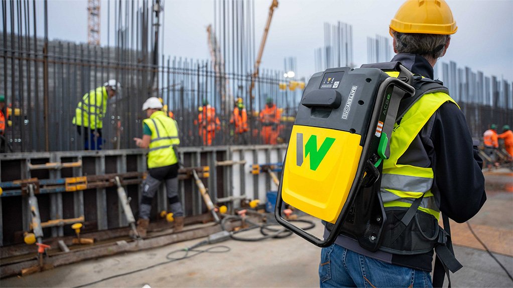 Image of a construction worker using a Wacker Neuson internal vibrator backpack system