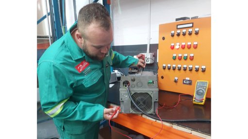 The above image depicts a BMG technician testing a VSD drive