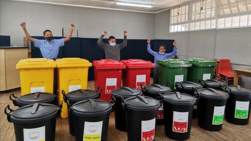 Image of school children with recycling bins