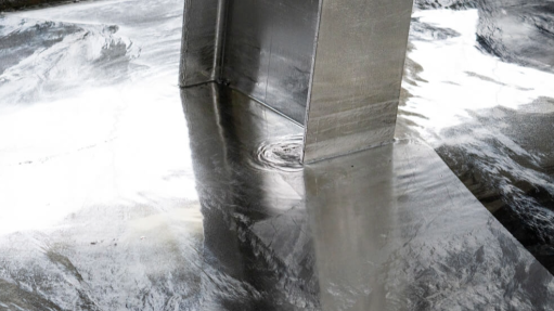 An image of a steel beam undergoing hot dip galvanising