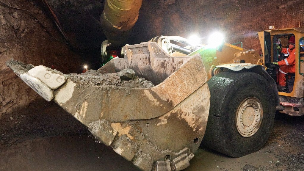 A large grader type machine in an underground tunnel fitted with PDS technology to avoid collisions