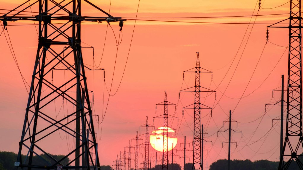 electricity pylons at sunset