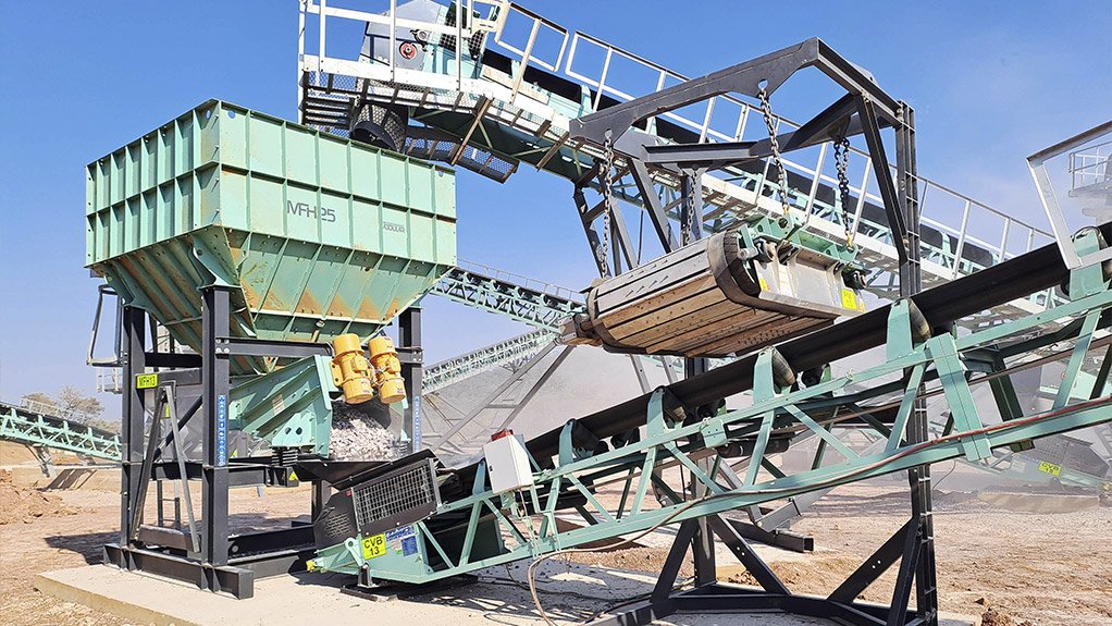 The Pilot Modular Feed Hopper MFH25 is used to control the feed to the cone crusher and an MPM910 magnet to remove tramp metal before the cone crusher