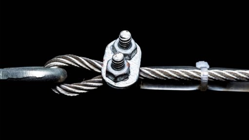 Wire rope coupled together to form a join on a black background