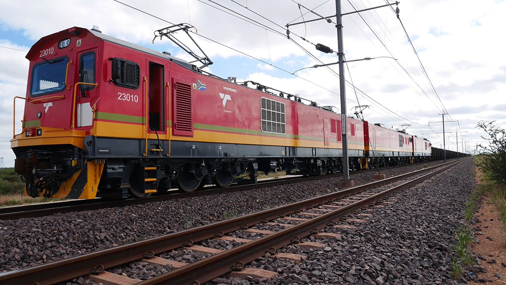 An image of a train on railway tracks