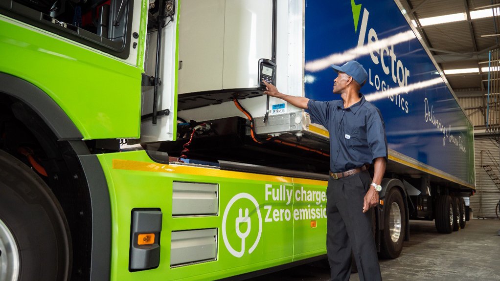 Driver trainer, Albert Zwane operates the new fridge control panel on the Battery Electric Vehicle (BEV) Volvo truck with solar powered trailer.