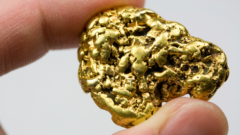 Gold nugget in hand