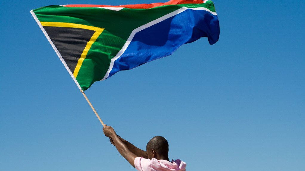 South African flag in hand