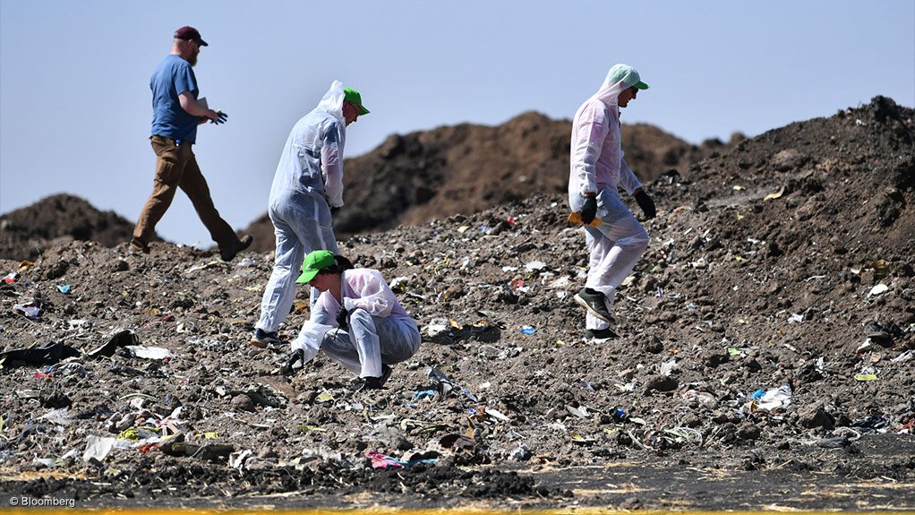 Investigators at the site of the Ethiopian Airlines crash in 2019