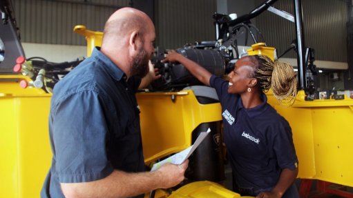 The above image depicts two Babcock technicians working on the rebuild of the A40 articulated hauler