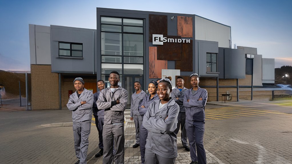 FLS apprentices in front of training academy
