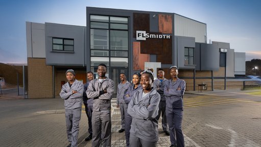 FLS apprentices in front of training academy