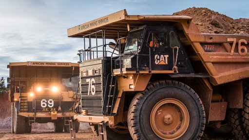 Haul trucks operating at a mine in West Africa