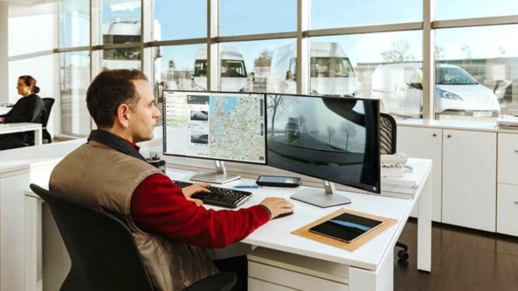 Image of a person in front of a computer screen