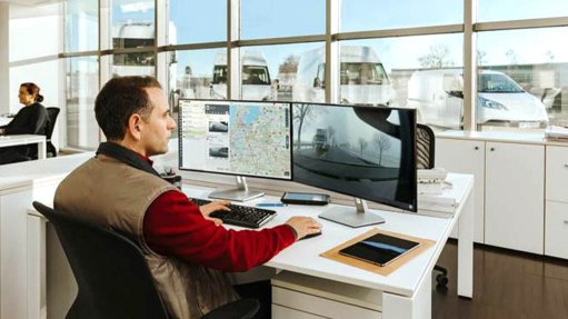 Image of a person in front of a computer screen
