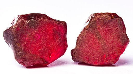 Rubies on a white surface.