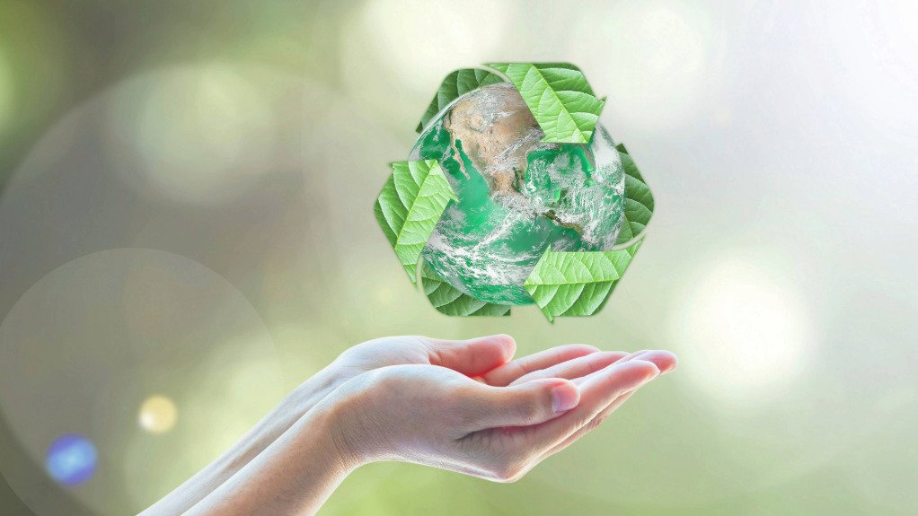 An image of a hand holding a globe