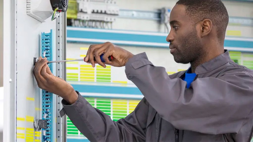 Image of a technician working on an electrical panel
