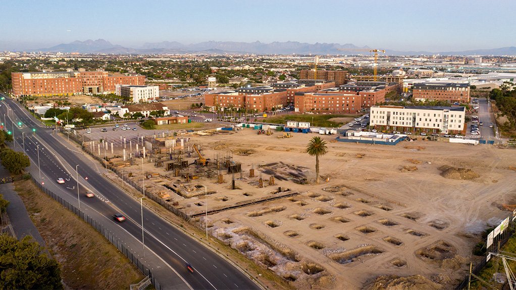 This aerial perspective of Conradie Park highlights the scale and progress of construction on The Pines retail centre within the broader precinct