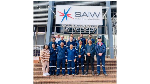 The above image depicts a group of learners in front of the SAIW