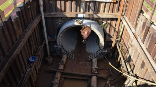 A construction site with the massive pipe