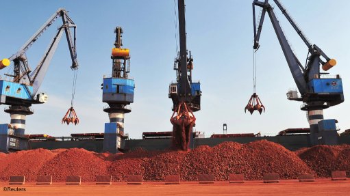 Bauxite being unloaded from a ship in China