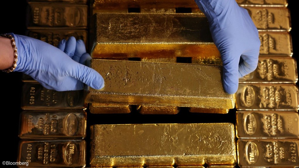 Gold bars being stacked
