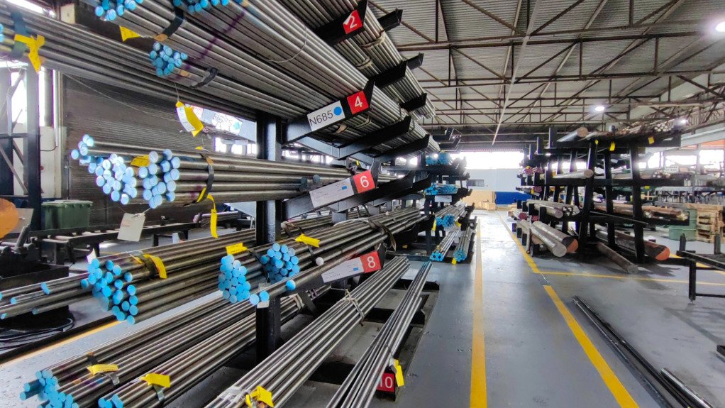 Large lengths of steel on shelves used for various applications in the automotive component manufacturing sector