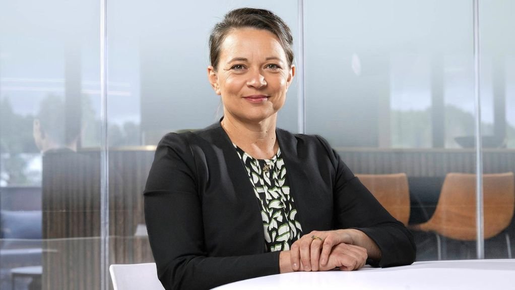 Gold Fields executive VP people and sustainability Mariette Steyn at a desk. 